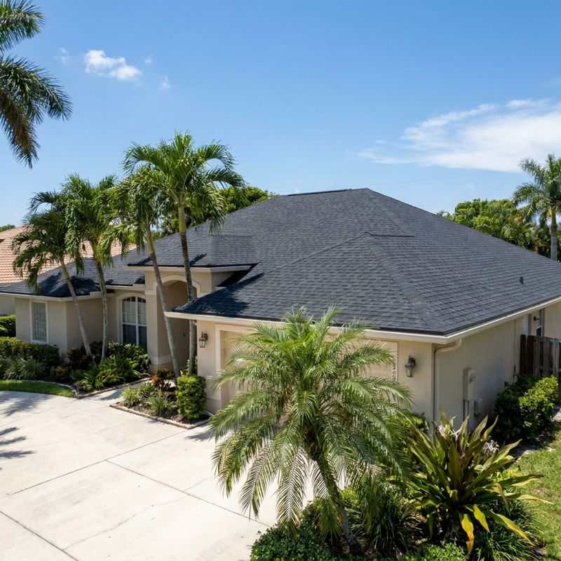 New dark charcoal shingle roof replacement on Hollywood Florida home